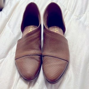 Fun shoes! Worn once around the house, never out the door!Textured like-leather!